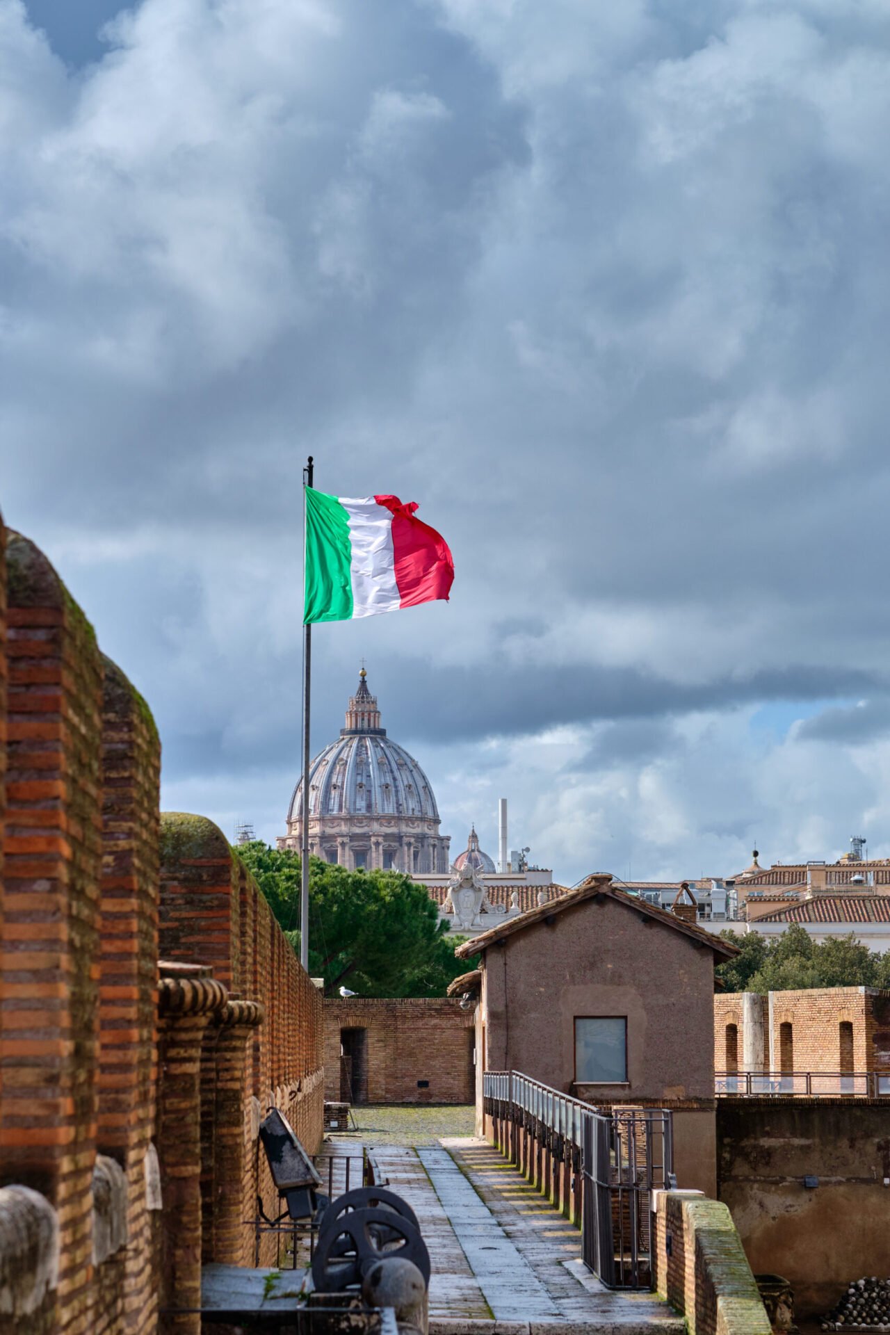 St. Peter's cathedral and flag of Italy in Rome